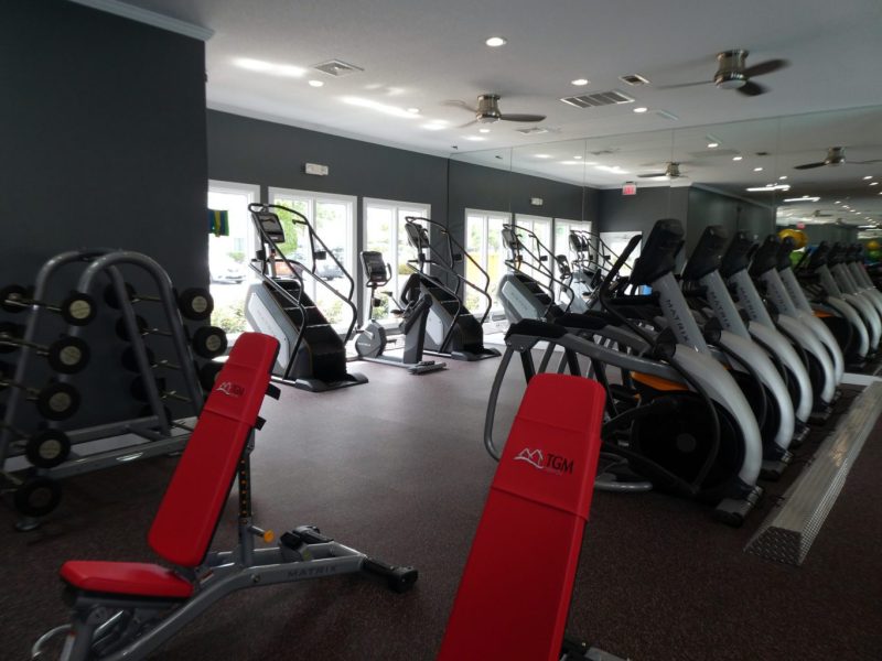 This image showcase the commercial fitness with State-of-the-art 2-level athletic club with Matrix Series 7xi equipment that is essential for community amenities, and offering indoor cycle.