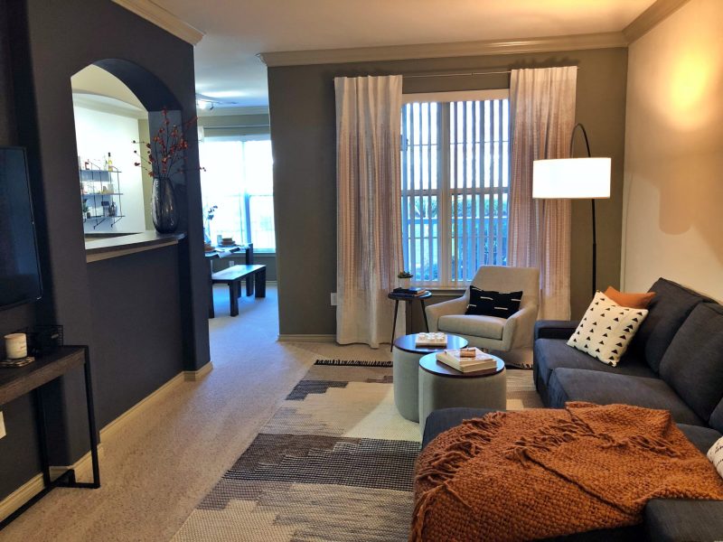 This image shows the living room area featuring elegant furniture and minimal wall decors that were suitable for a spacious area. The living room was also accessible to the dining area.
